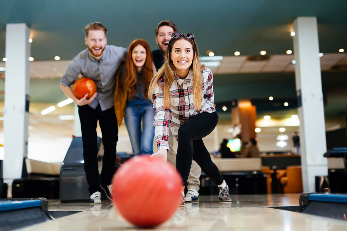 group of young people Bowling in Drug Rehab
