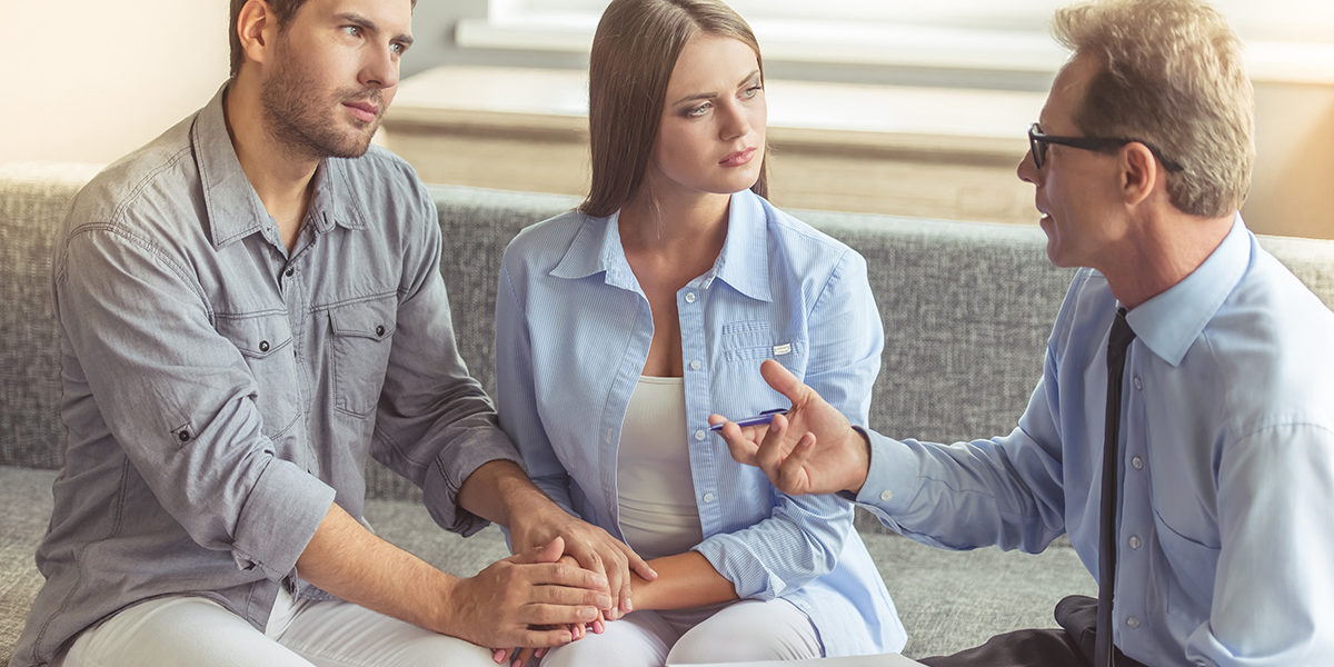 man and wife holding hands in Couples Addiction Therapy