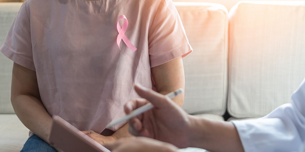 woman with awareness ribbon at mental health treatment and addiction therapy