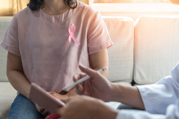 woman with awareness ribbon at mental health treatment and addiction therapy