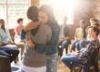 two women hugging to stop being lonely in addiction recovery