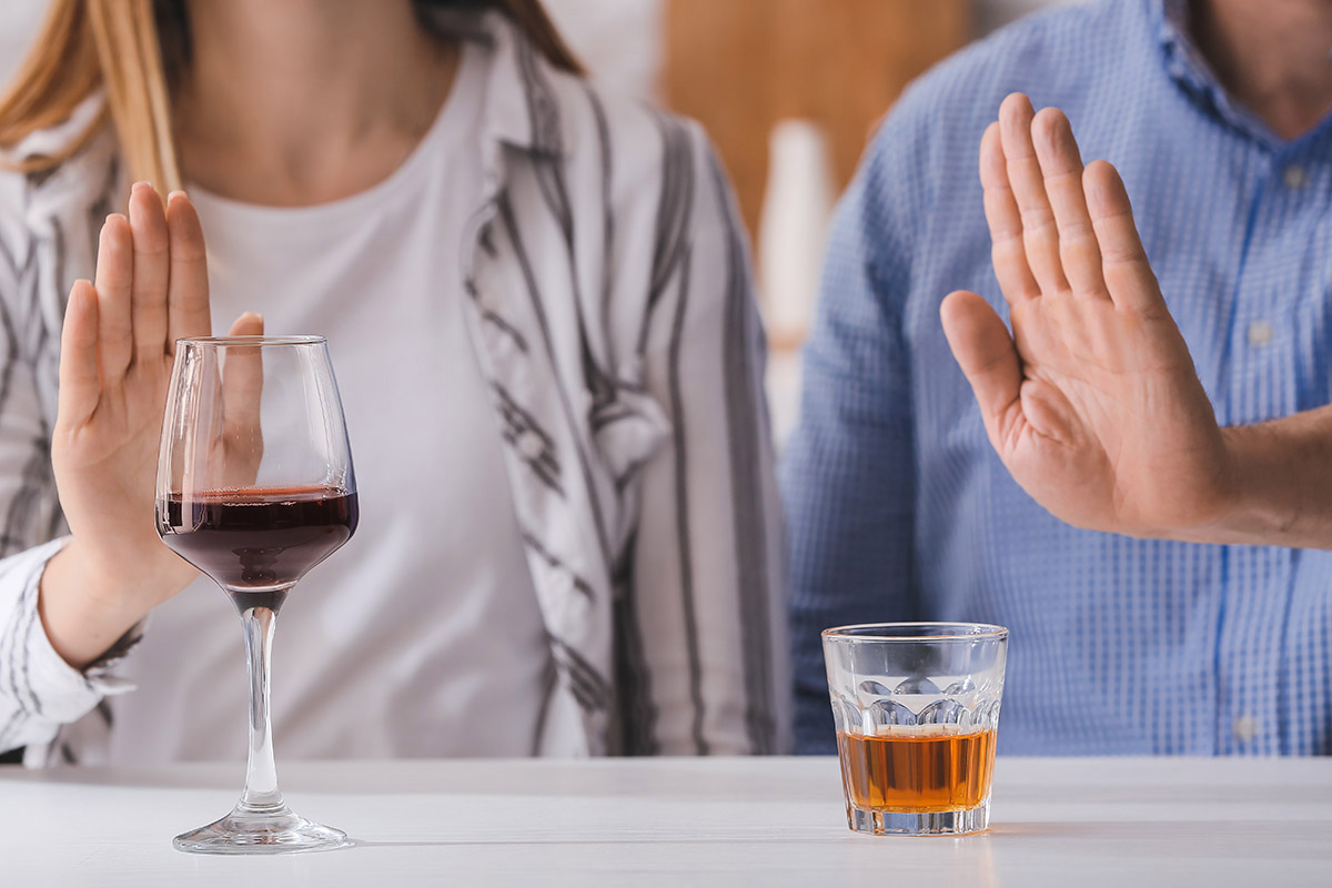man and a woman refuse alcohol
