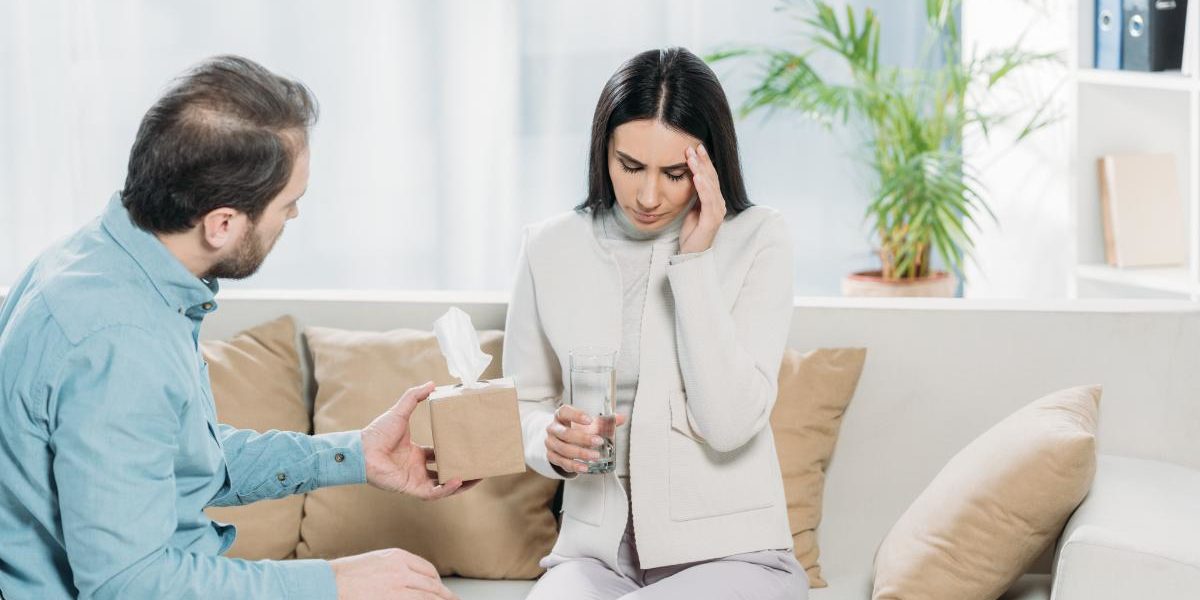 woman talking to male on couch