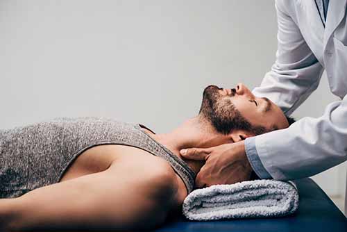 man participates in chiropractic care for detox