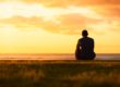Man watching a sunset and thinking about the heroin addiction recovery rate