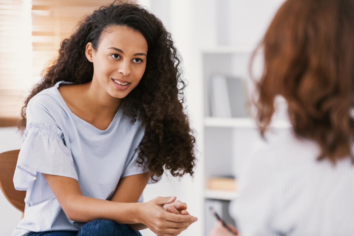 Young woman coming to grips with the definition of sobriety