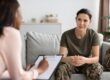 Female vet hearing about mental health and substance abuse in veterans